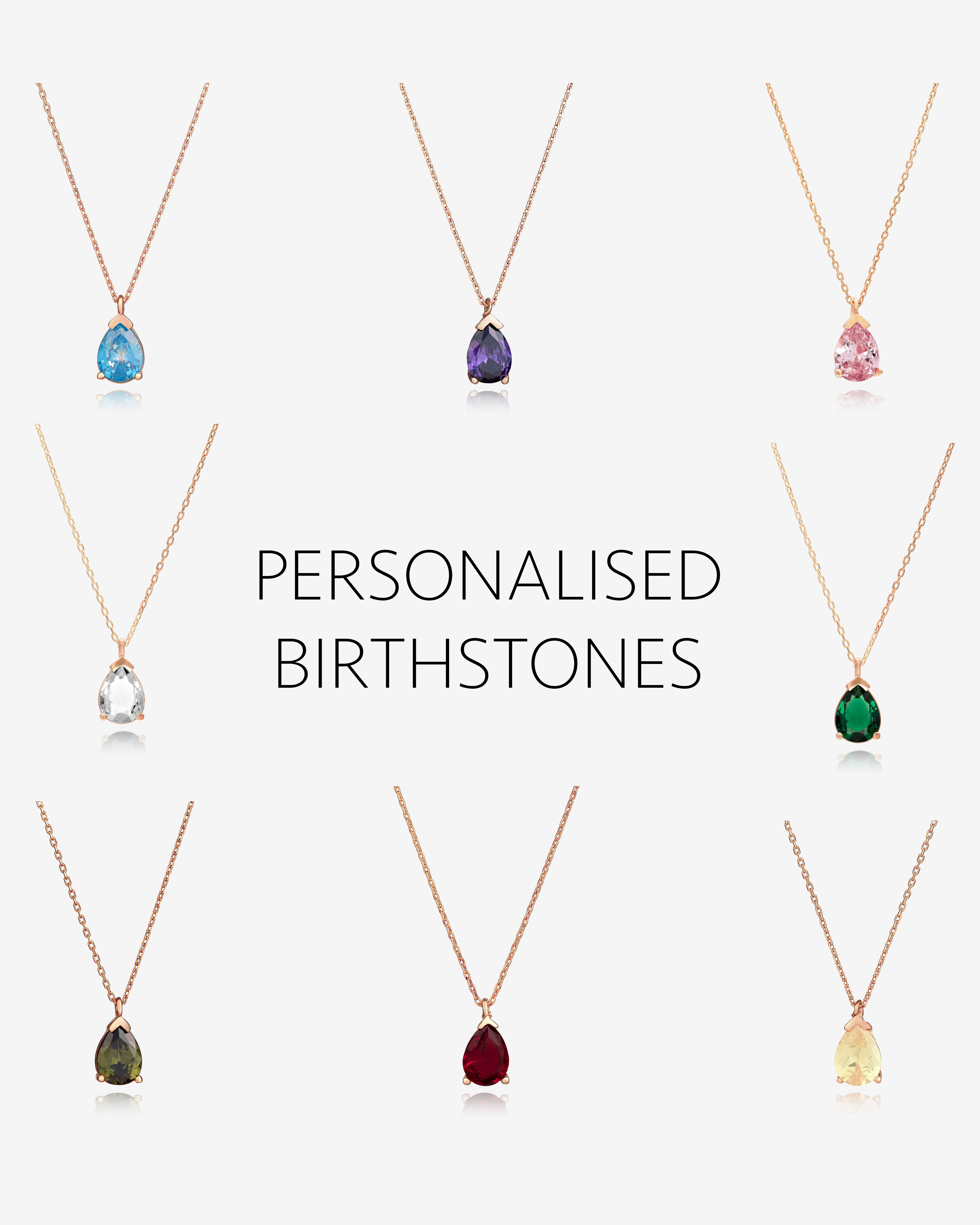Collection of personalized birthstone necklaces on a white background