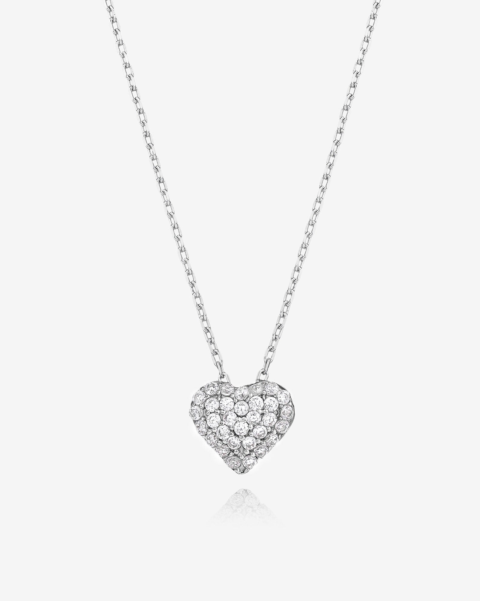 Heart-shaped diamond necklace on a white background