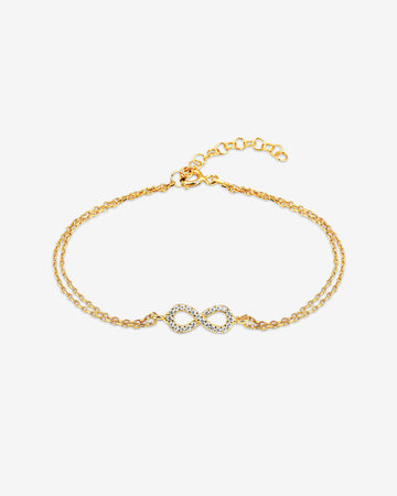 Gold bracelet with interlocking heart charms on a white background