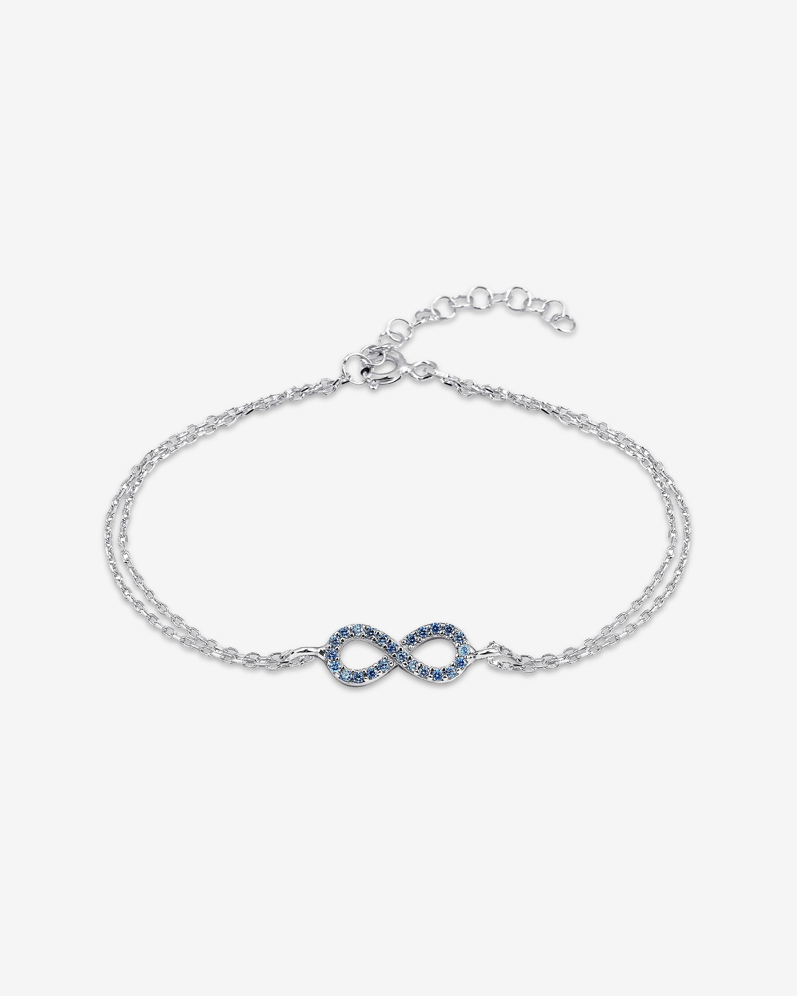 Silver bracelet with a blue infinity symbol charm on a white background